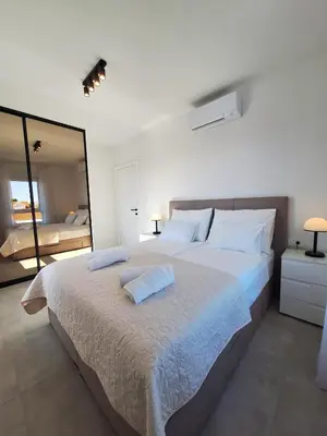Krevet ili kreveti u jedinici u objektu Andigo Seaview Apartment Vodice