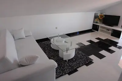 TV i/ili zabavni centar u objektu Apartments Villa Leona