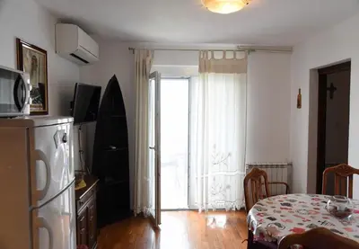 TV i/ili zabavni centar u objektu Apartments Ema