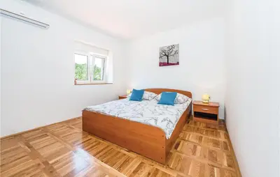 Krevet ili kreveti u jedinici u objektu Holiday Home Bilice Xiv
