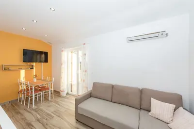 TV i/ili zabavni centar u objektu Apartments Summertime