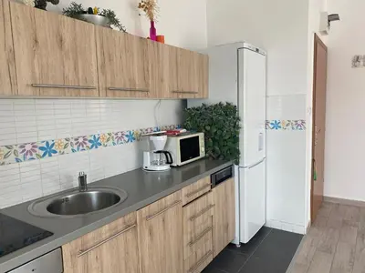 Kuhinja ili čajna kuhinja u objektu Sunny Apartment