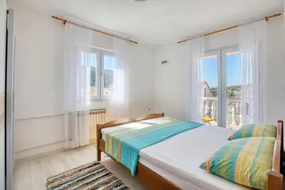 Krevet ili kreveti u jedinici u objektu Apartments by the sea Grebastica, Sibenik - 11463