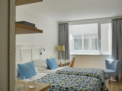 Krevet ili kreveti u jedinici u objektu Amadria Park Beach Hotel Jure