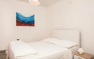 Krevet ili kreveti u jedinici u objektu Four-Bedroom Holiday Home In Cista Velika