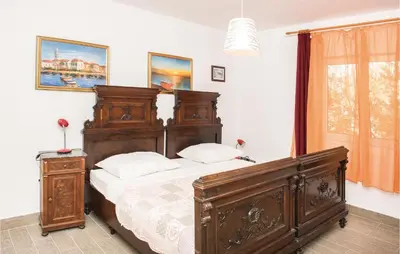 Krevet ili kreveti u jedinici u objektu Four-Bedroom Holiday Home In Cista Velika
