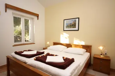 Krevet ili kreveti u jedinici u objektu Apartments by the sea Rogoznica - 3094