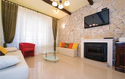 TV i/ili zabavni centar u objektu Four-Bedroom Holiday Home In Brodarica