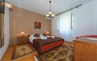 Krevet ili kreveti u jedinici u objektu Four-Bedroom Holiday Home In Brodarica