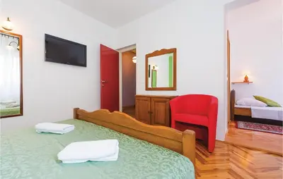 Krevet ili kreveti u jedinici u objektu Four-Bedroom Holiday Home In Brodarica