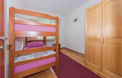 Krevet ili kreveti u jedinici u objektu Three-Bedroom Holiday Home In Rozovac