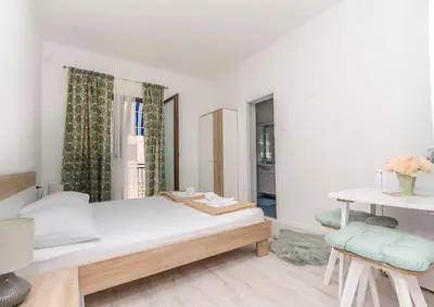 Krevet ili kreveti u jedinici u objektu Apartments and Rooms Bepina