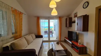 TV i/ili zabavni centar u objektu Apartmani Villa Lilliana