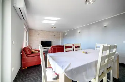 TV i/ili zabavni centar u objektu Apartments Oto