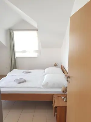 Krevet ili kreveti u jedinici u objektu Apartments Palaca Sunca