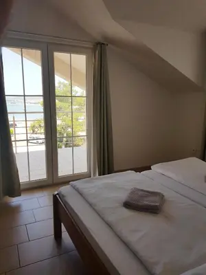 Krevet ili kreveti u jedinici u objektu Apartments Palaca Sunca