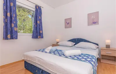 Krevet ili kreveti u jedinici u objektu Six-Bedroom Holiday Home In Sibenik