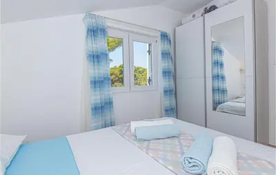 Krevet ili kreveti u jedinici u objektu Six-Bedroom Holiday Home In Sibenik