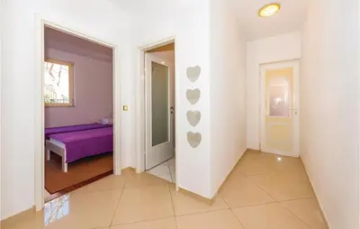 Krevet ili kreveti u jedinici u objektu Three-Bedroom Apartment In Rogoznica
