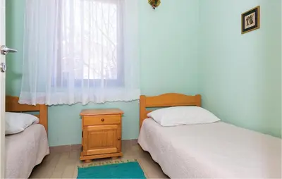 Krevet ili kreveti u jedinici u objektu Two-Bedroom Apartment In Rogoznica