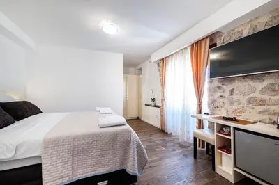 TV i/ili zabavni centar u objektu Rialto Luxury Rooms and Apartments