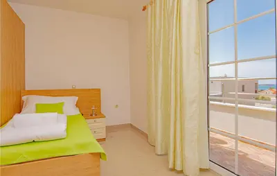 Krevet ili kreveti u jedinici u objektu Four-Bedroom Holiday Home In Brodarica