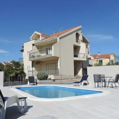 Seaside apartments with a swimming pool Brodarica