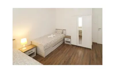 Krevet ili kreveti u jedinici u objektu Two-Bedroom Holiday Home In Sibenik