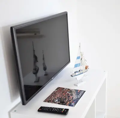 TV i/ili zabavni centar u objektu Villa M - Your business & holiday apartment in Sibenik