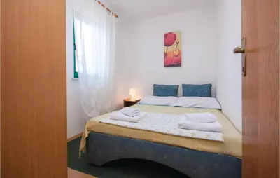 Krevet ili kreveti u jedinici u objektu Three-Bedroom Apartment In Pirovac