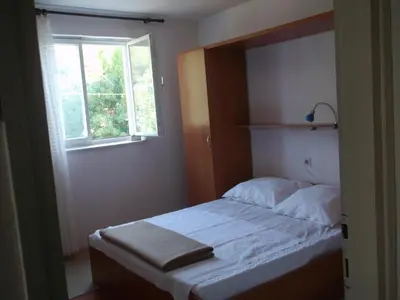 Krevet ili kreveti u jedinici u objektu apartmani srecko