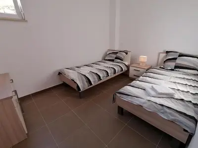 Krevet ili kreveti u jedinici u objektu Apartment by the Beach in Dalmatia