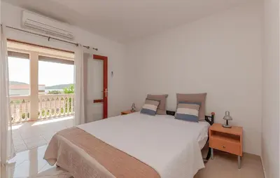 Krevet ili kreveti u jedinici u objektu Two-Bedroom Apartment In Pirovac