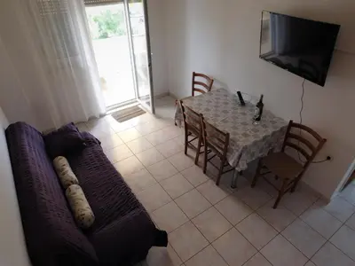 TV i/ili zabavni centar u objektu Charming apartment Karlo