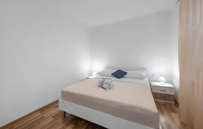 Krevet ili kreveti u jedinici u objektu Four-Bedroom Holiday Home In Slivno