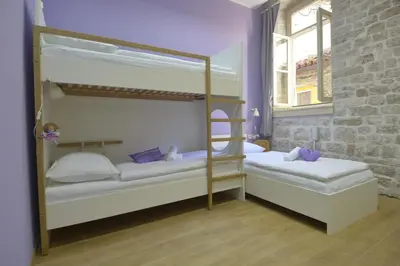 Krevet ili kreveti u jedinici u objektu Hostel Sv. Lovre