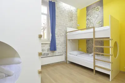 Krevet ili kreveti u jedinici u objektu Hostel Sv. Lovre