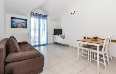TV i/ili zabavni centar u objektu One-Bedroom Apartment In Jezera