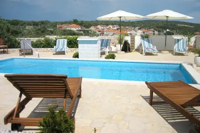 Bazen u objektu Family-friendly apartments with swimming pool Dvornica - Rogoznica - 11470 ili u blizini