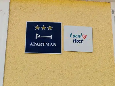 Certifikat, nagrada, logo ili neki drugi dokument izložen u objektu Apartmani Slavica
