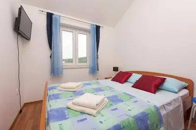 Krevet ili kreveti u jedinici u objektu Apartments Vladimir