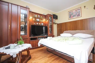 TV i/ili zabavni centar u objektu Goles apartments-First row to the sea