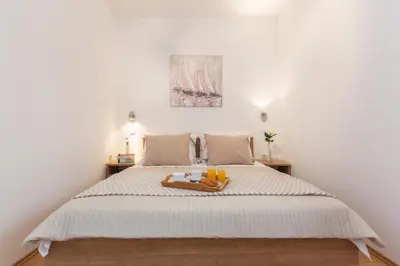 Krevet ili kreveti u jedinici u objektu Quiet Family Apartments 30m from Beach Rogoznica Maiv Residence Zatoglav