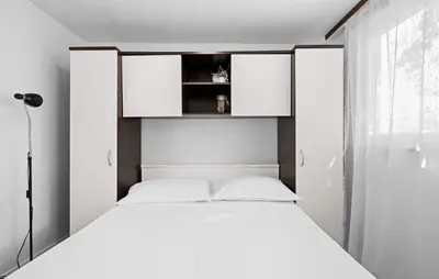 Krevet ili kreveti u jedinici u objektu Regina Apartments