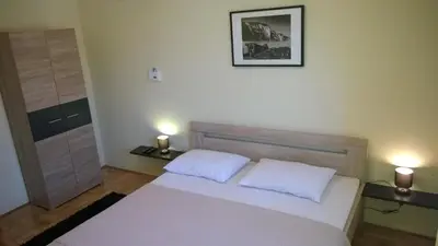 Krevet ili kreveti u jedinici u objektu Rooms & Apartments Blue Beach