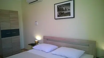 Krevet ili kreveti u jedinici u objektu Rooms & Apartments Blue Beach