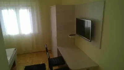 TV i/ili zabavni centar u objektu Rooms & Apartments Blue Beach