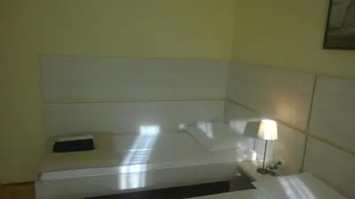 Krevet ili kreveti u jedinici u objektu Rooms & Apartments Blue Beach