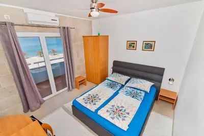 Krevet ili kreveti u jedinici u objektu Rooms & Apartments Marinero