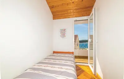 Krevet ili kreveti u jedinici u objektu Three-Bedroom Holiday Home In Rogoznica